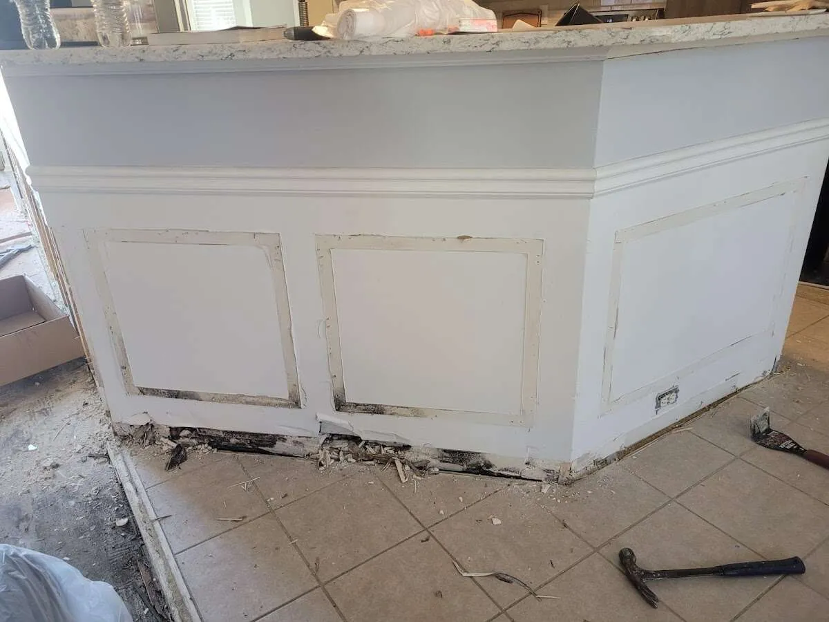Water damage and mold on kitchen during Sewage Cleanup & Sanitation in Manalapan